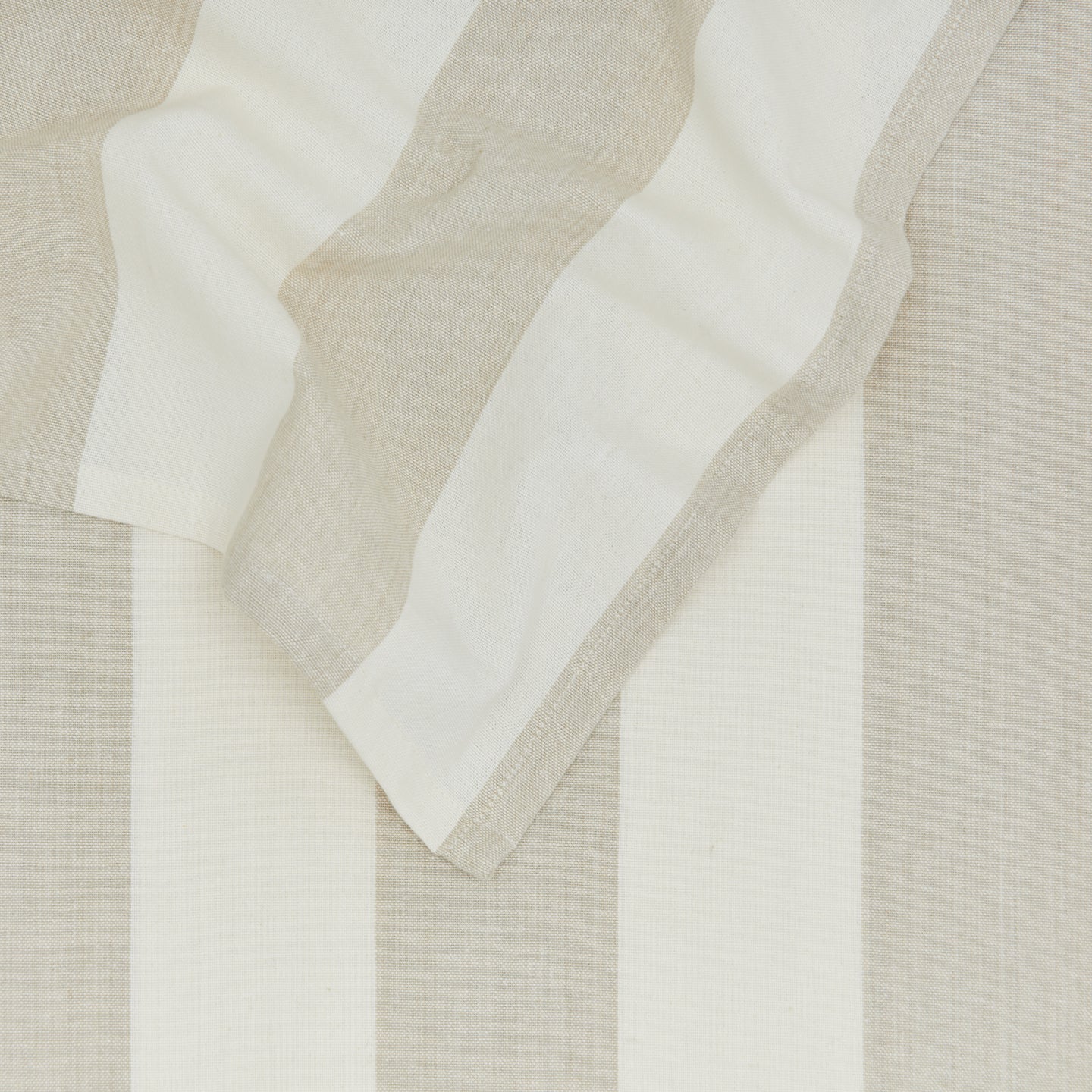 Close up of Essential Striped Tablecloth in Ivory and Flax.