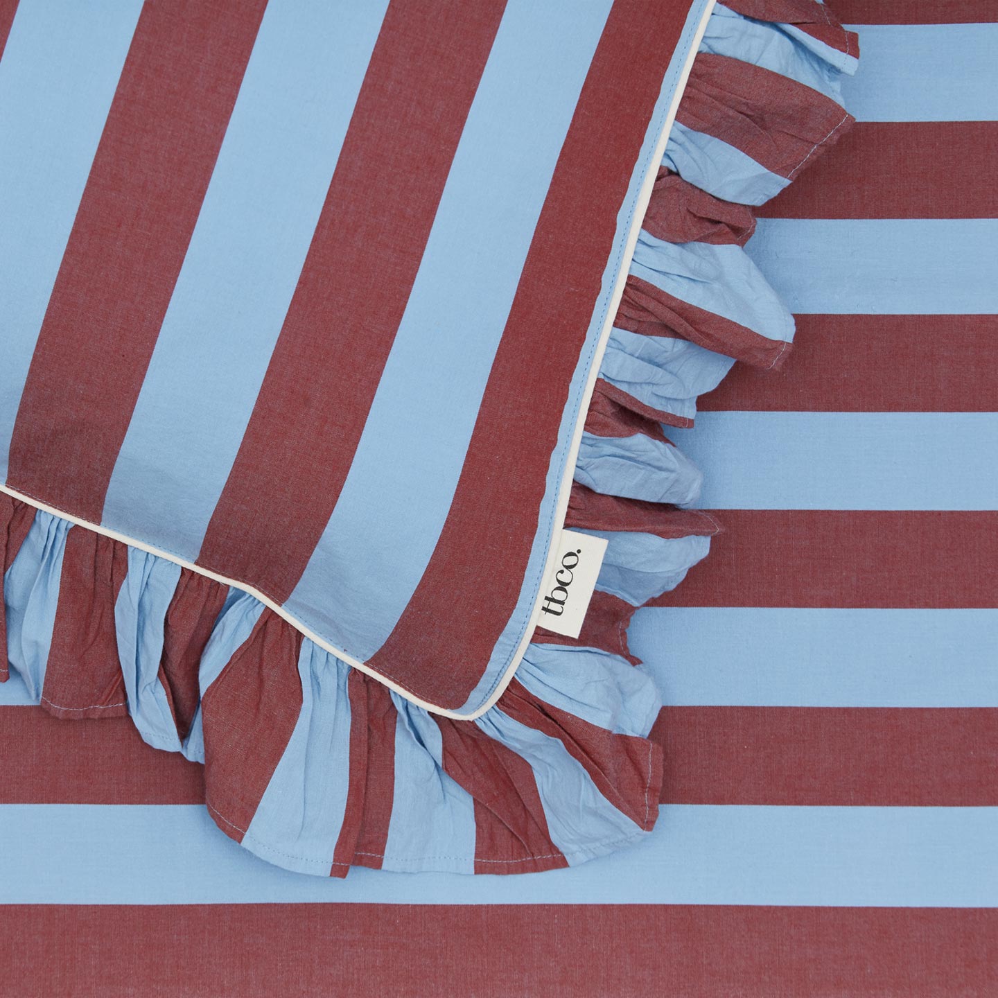 Blue and red striped pillowcase detail