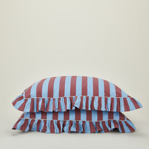 2 Stacked ruffled pillowcases in blue and red