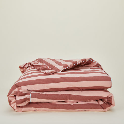 Folded blush and terracotta striped ruffled duvet cover
