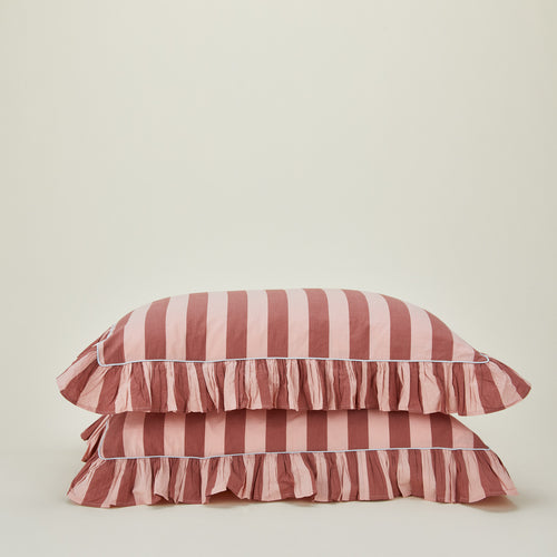2 stacked blush and terracotta pillowcases